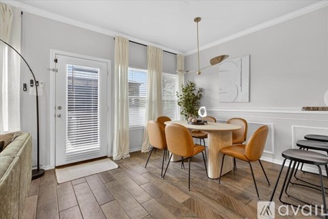 A dining room with a table set for four.