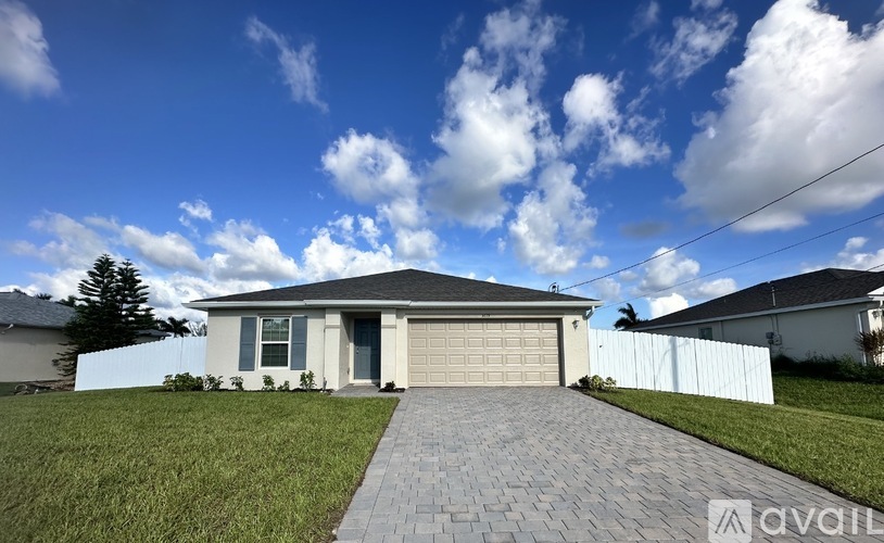 A house with a driveway in front of it.