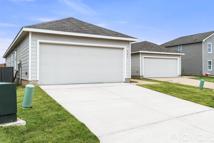 A two-car garage is attached to a house.