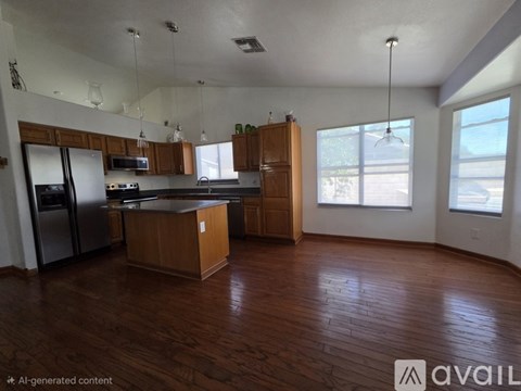 A kitchen with wooden floors and a large island.