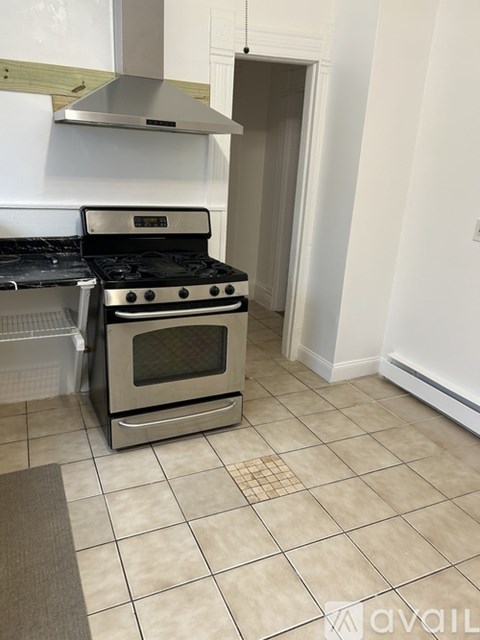 A kitchen with a stove and oven.