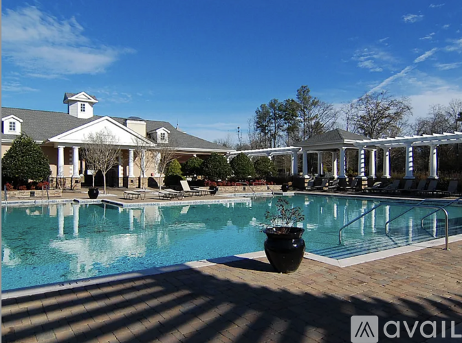 A pool with a building in the background.
