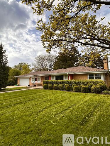 A house with a lawn in front of it.