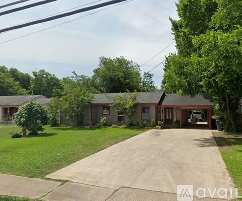 A house with a driveway in front of it.