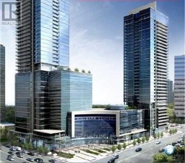 A modern building complex with a glass facade and a sign that reads "REALTOR".