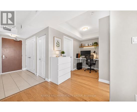 A room with a desk and a chair in it.