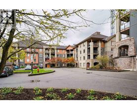 A large building with a courtyard in front of it.