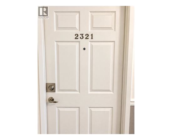 A white door with the number 2321 on it.