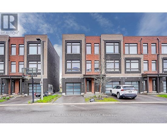 A street view of a residential area with a car parked in front of a building.