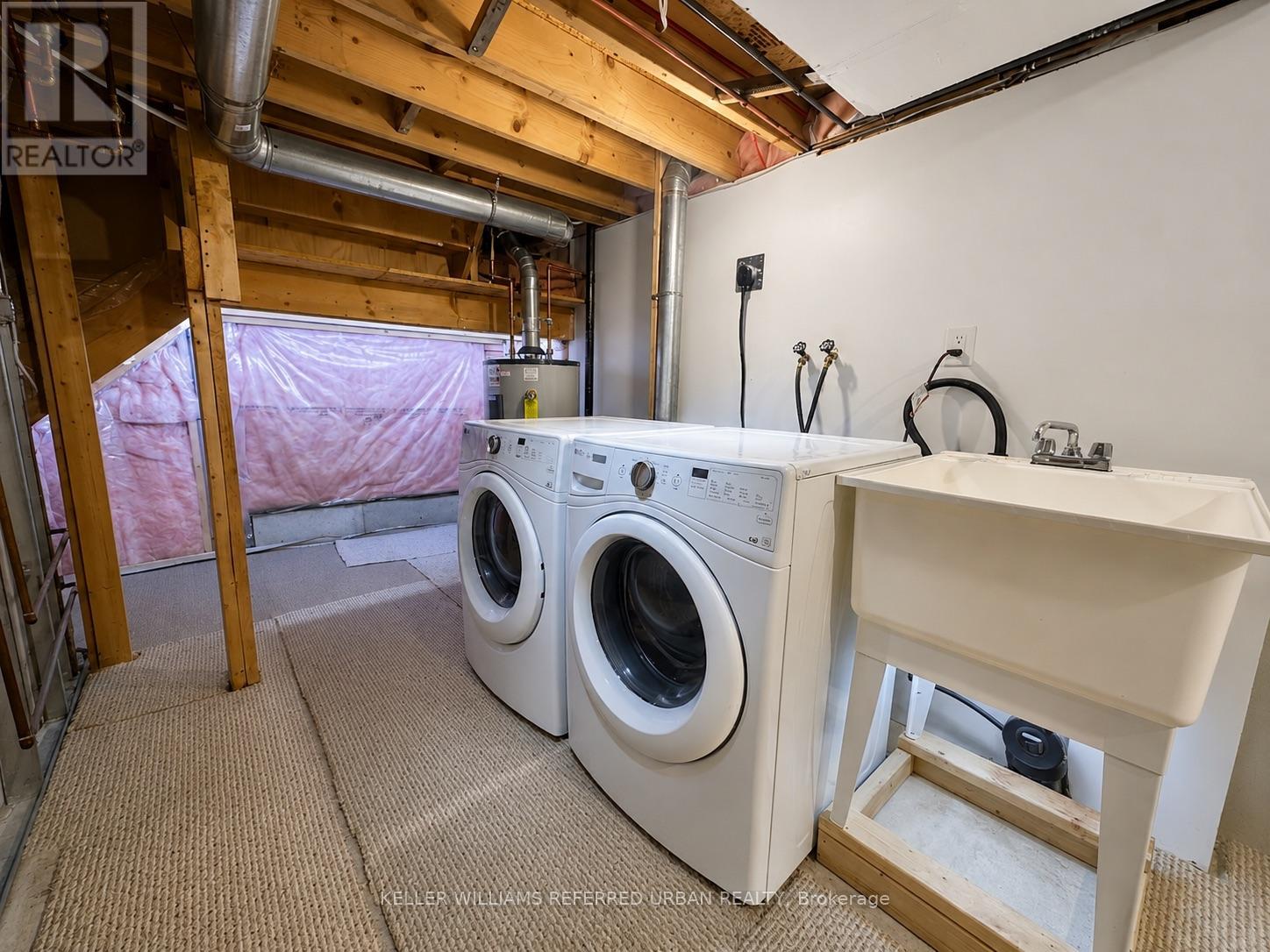 A laundry room with a washer and dryer.