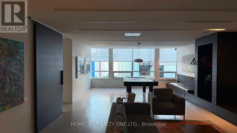 A modern living room with a dining table and chairs is showcased.