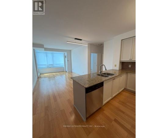 A kitchen with a sink and a dishwasher.