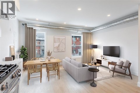 A modern living room with a dining table and a sofa.