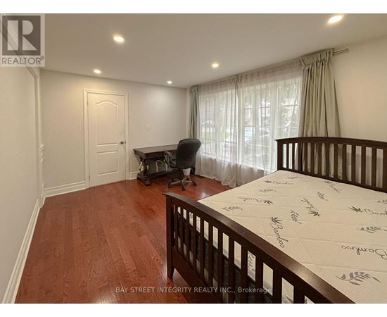 A baby's room with a crib and a rocking chair.