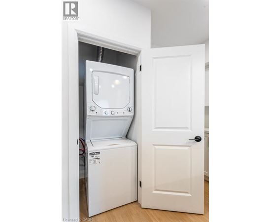 A white washer and dryer in a small space.