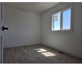 A room with a window and a door.