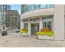A building with the number 195 on it has a flower box on the front.