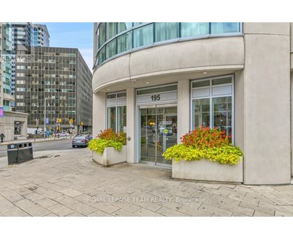 A building with the number 195 on it has a flower box on the front.