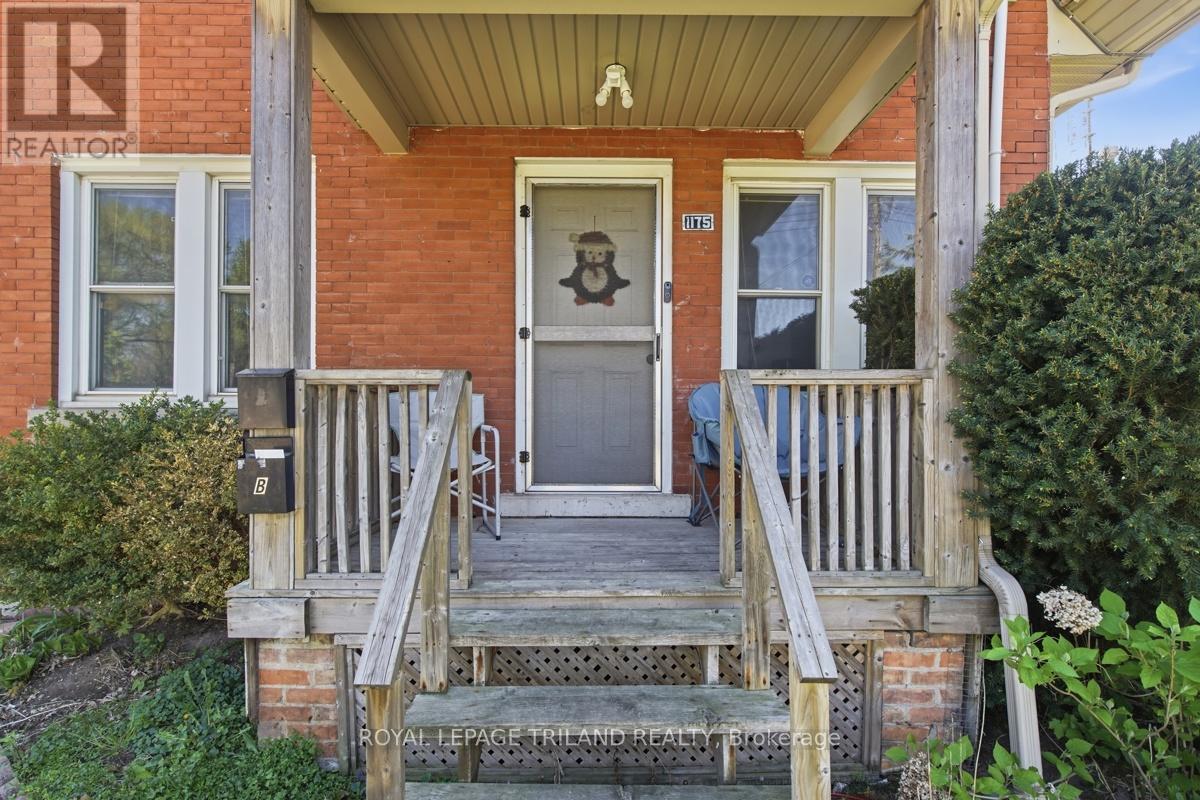 A house with a porch and a door with a number 101 on it.