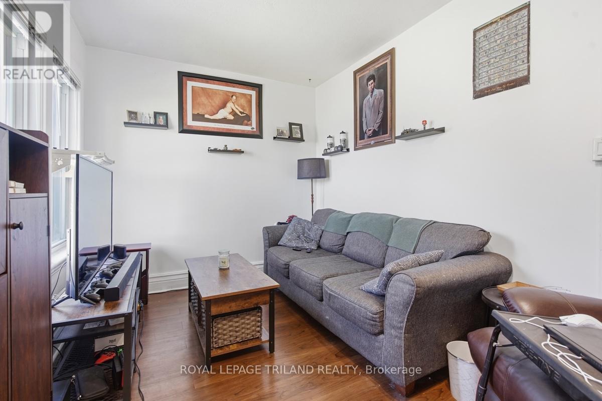 A living room with a grey couch and a coffee table.