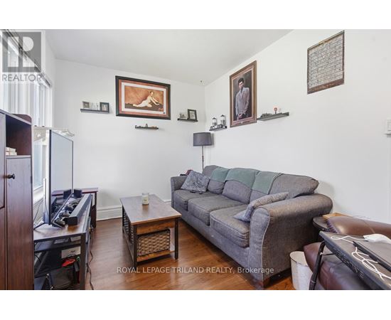 A living room with a grey couch and a coffee table.