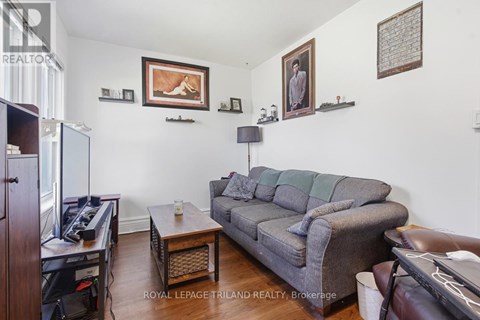 A living room with a grey couch and a coffee table.