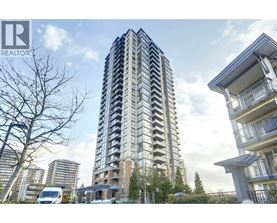 A tall residential building with a balcony on the right side.