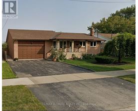 A house with a brown roof and a garage is shown.