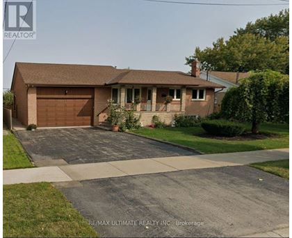 A house with a brown roof and a garage is shown.