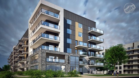 A modern multi-story building with balconies and large windows.