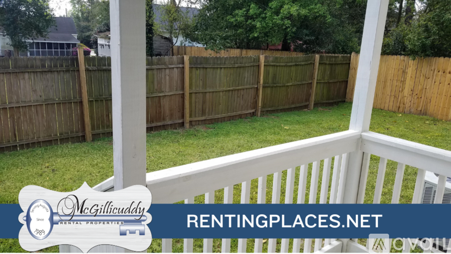 A white railing with a McGillicuddy sign and RENTINGPLACES.NET logo.