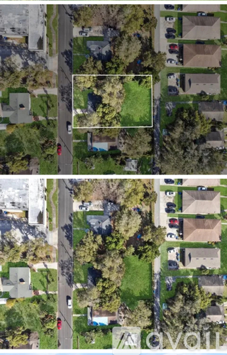 A bird's eye view of a residential area with houses and trees.
