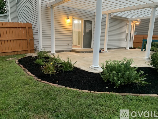 A house with a front yard and a garden.