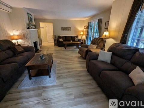 A living room with a fireplace and a couch.