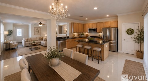 A modern kitchen with a wooden table and chairs in the foreground.