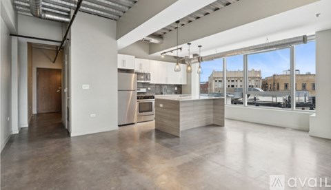 A spacious kitchen with a view of the city.
