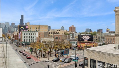 A city street with cars and buildings.