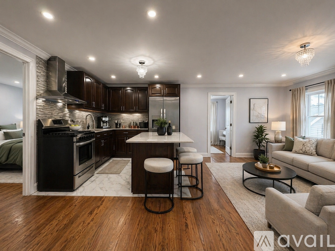 A modern kitchen with dark wood cabinets and a black stove top oven.