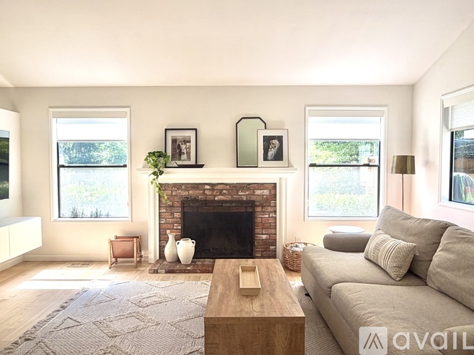 A living room with a fireplace and a couch.