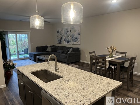 A kitchen with a granite countertop and a sink.