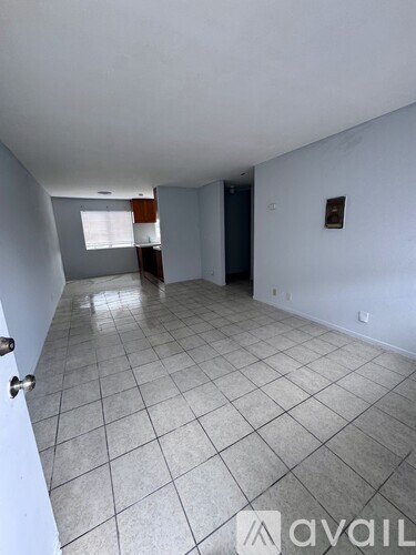 A room with white walls and a tiled floor.