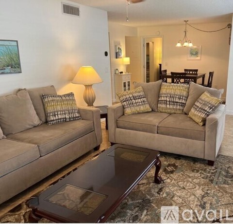 A living room with two couches and a coffee table.