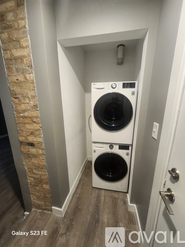 A washer and dryer in a small laundry room.