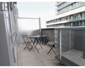 A balcony with a table and chairs is shown with the text "LPT REALTY, Brokerage".