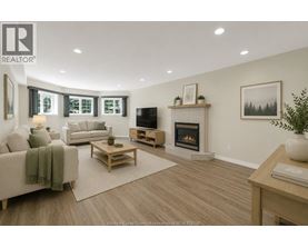 A living room with a fireplace and a television.