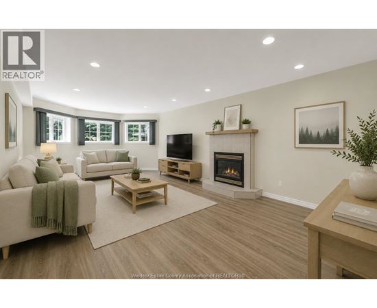 A living room with a fireplace and a television.