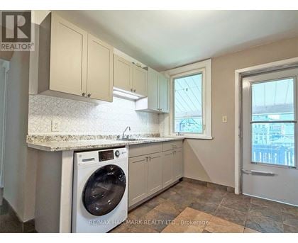 A laundry room with a washer and dryer in it.
