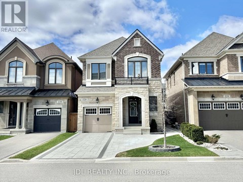 A row of houses with the logo JDL REALTY INC. Brokerage on the bottom left.