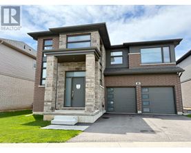 A modern two-story house with a garage is for sale.
