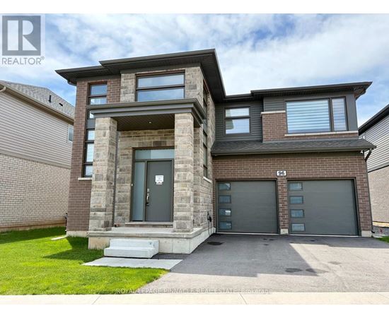 A modern two-story house with a garage is for sale.